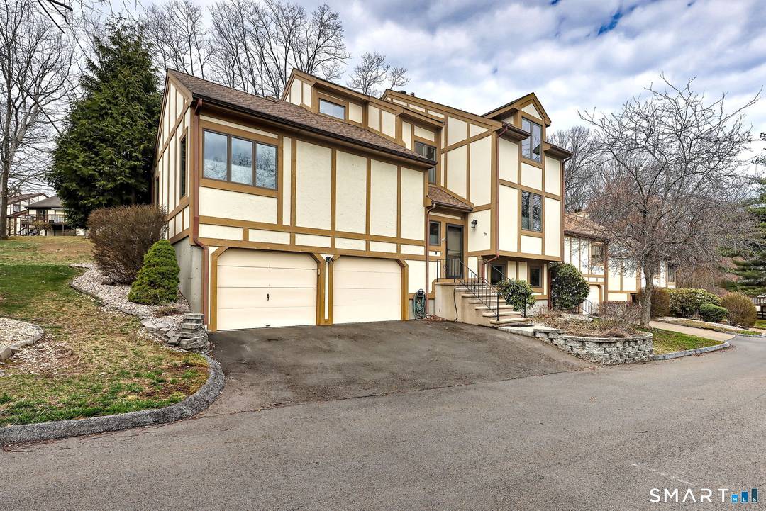 Oronoque Forest Complex. Step into this exquisite 3 level townhouse, end unit, featuring soaring cathedral ceilings and a dramatic fireplace wall that creates an impressive focal point.