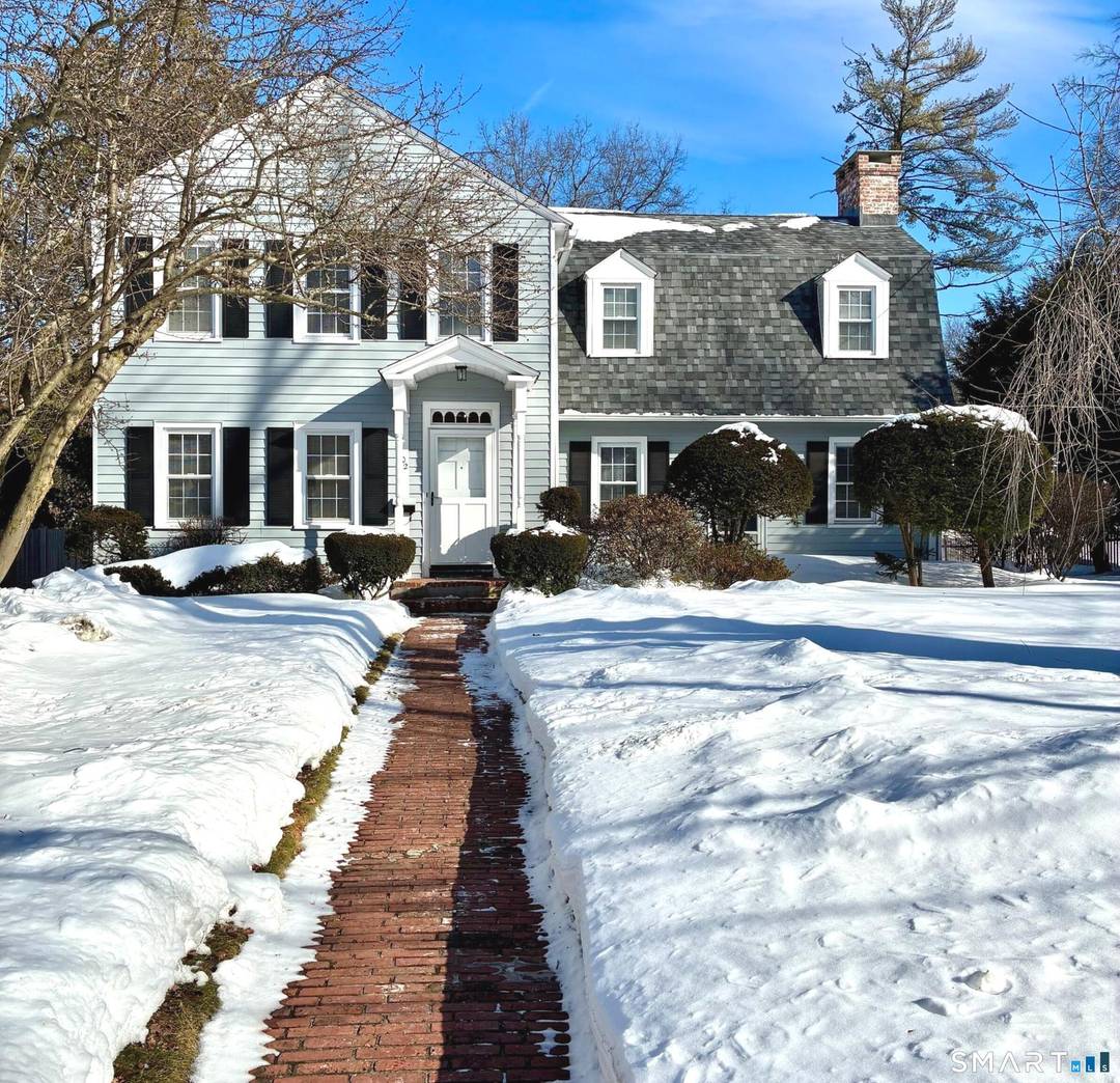 Sun filled classic center hall Colonial on one of West Hartford's prettiest streets.