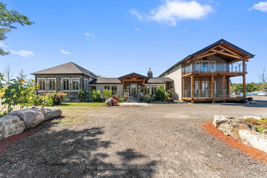 Set on 10 private acres surrounded by scenic conservation land, this exceptional estate offers luxury, privacy, and income potential.