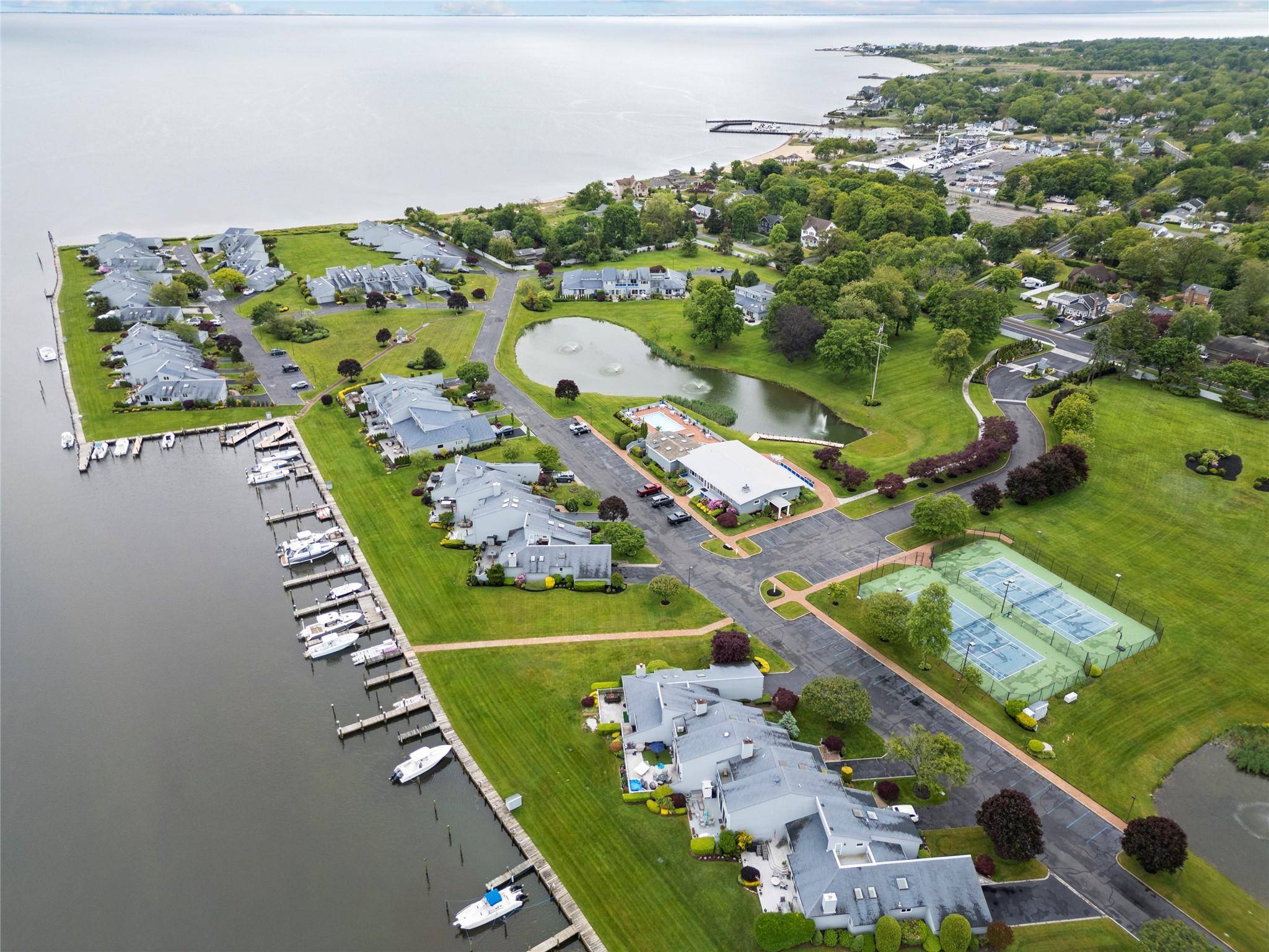 Experience the ultimate in waterfront living with this completely furnished 2 bedroom, 2 bath townhouse in the exclusive, gated community of The Harbour at Blue Point, located directly on the ...