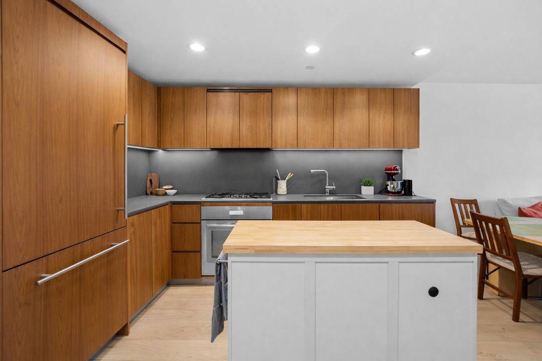 Quiet, courtyard facing and filled with natural light, this thoughtfully designed 2 bedroom, 1.