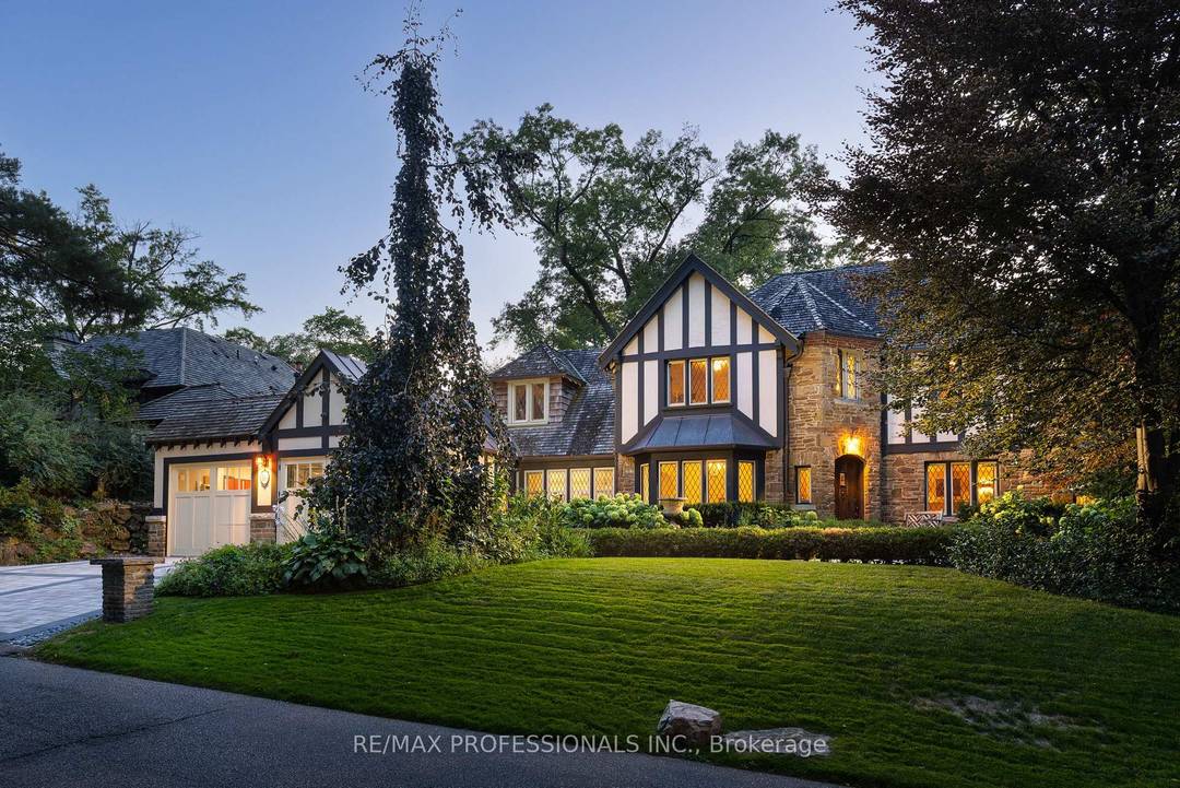 Magnificent R. Home Smith Tudor set on an elevated lot across from the Humber River Valley.