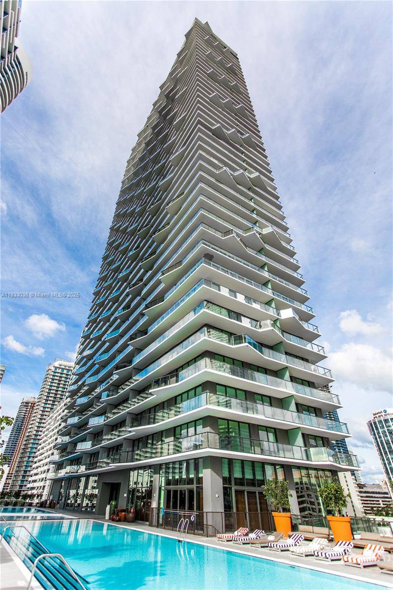 Live in the stylish 1300 S Miami Ave Condominium in this designer furnished 2 bedroom plus den corner wrap around residence with City views of Miami, Brickell and Coconut Grove.
