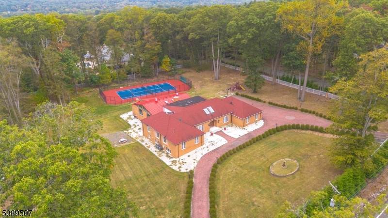 Welcome to this private resort estate just 15 miles from NYC, set on 2.