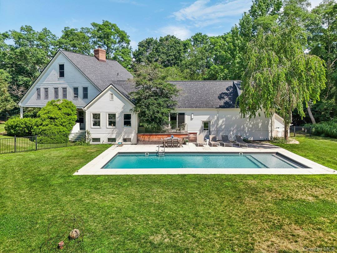Welcome to 17 Oak Meadow Lane, nestled in a sought after cul de sac in south Bellport Village !