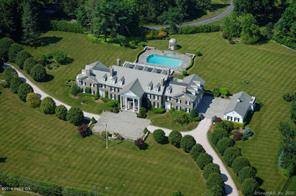 Parklike Estate in Greenwich, CT Breathtaking sunsets and formal gardens inspire a magnificent Georgian Colonial stone estate house located 560 feet high above sea level on 4.