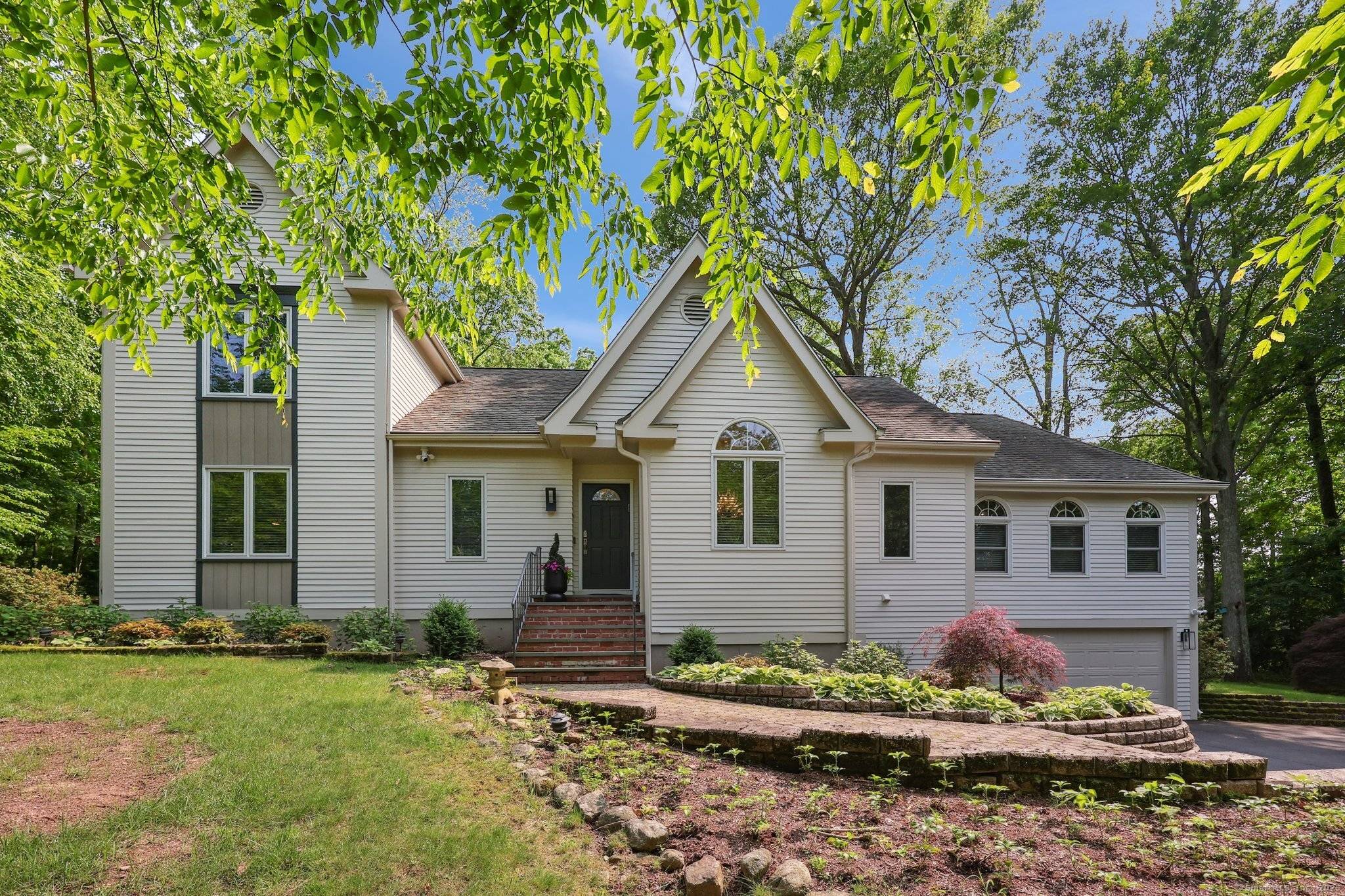 One of a kind home in a small, sought after subdivision close to the heart of charming Madison, CT.