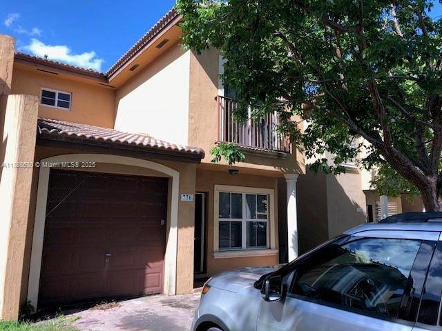 Fee simple townhouse, no HOA approval, garage, tile floors, fenced backyard, front yard with paved driveway.
