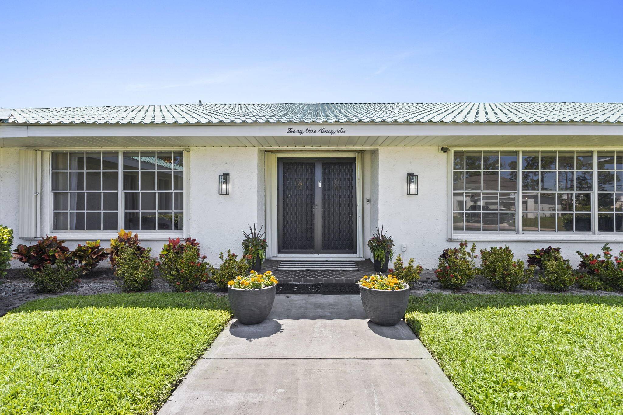 Welcome to 2196 SE Flanders Road, a meticulously maintained estate in the heart of Port Saint Lucie.