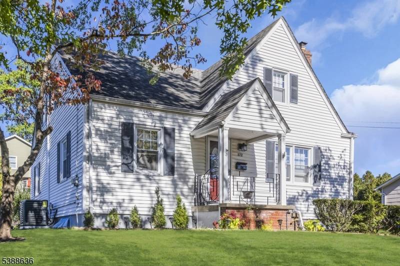 Charming Cape Cod with Modern Kitchen, Flexible Living Spaces Home Office.