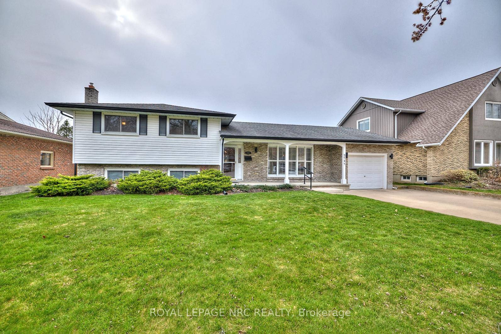Charming North End Sidesplit with Inground Pool.