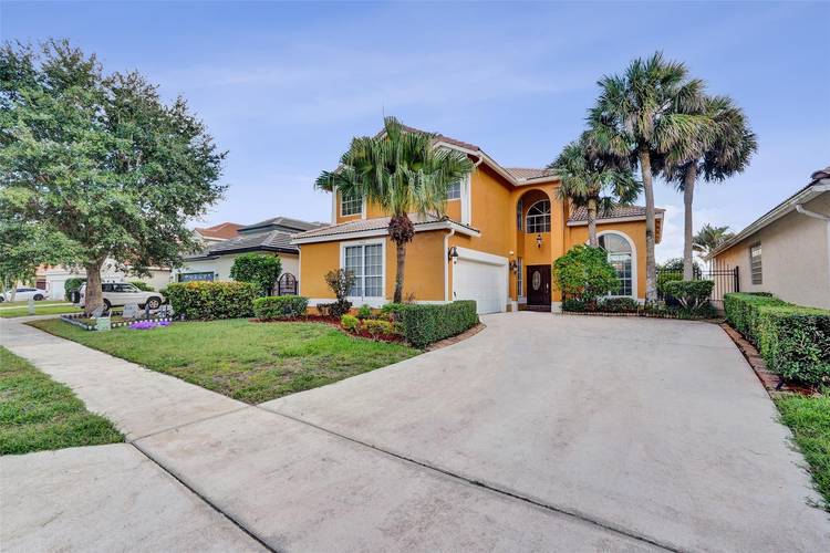 Beautifully upgraded and meticulously maintained, this rare offering in the sought after Lakes of Boca community features 4 bedrooms, 2.