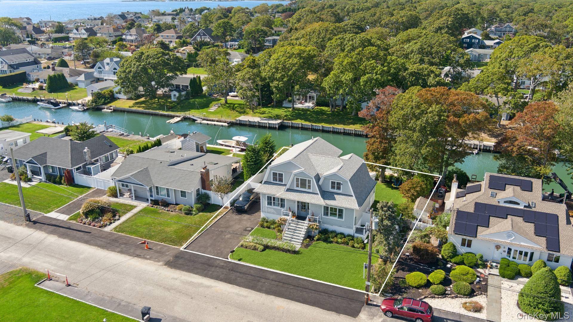 Where Waterfront Serenity Meets Hamptons Style Embrace the effortless beauty of Hamptons living in this brand new waterfront home in the exclusive Shinnecock Shores community.