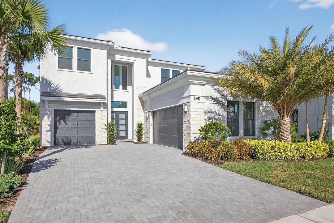 Never lived in and newly constructed, 13334 Artisan Circle offers exceptional scale, flow, and privacy in the heart of Palm Beach Gardens.