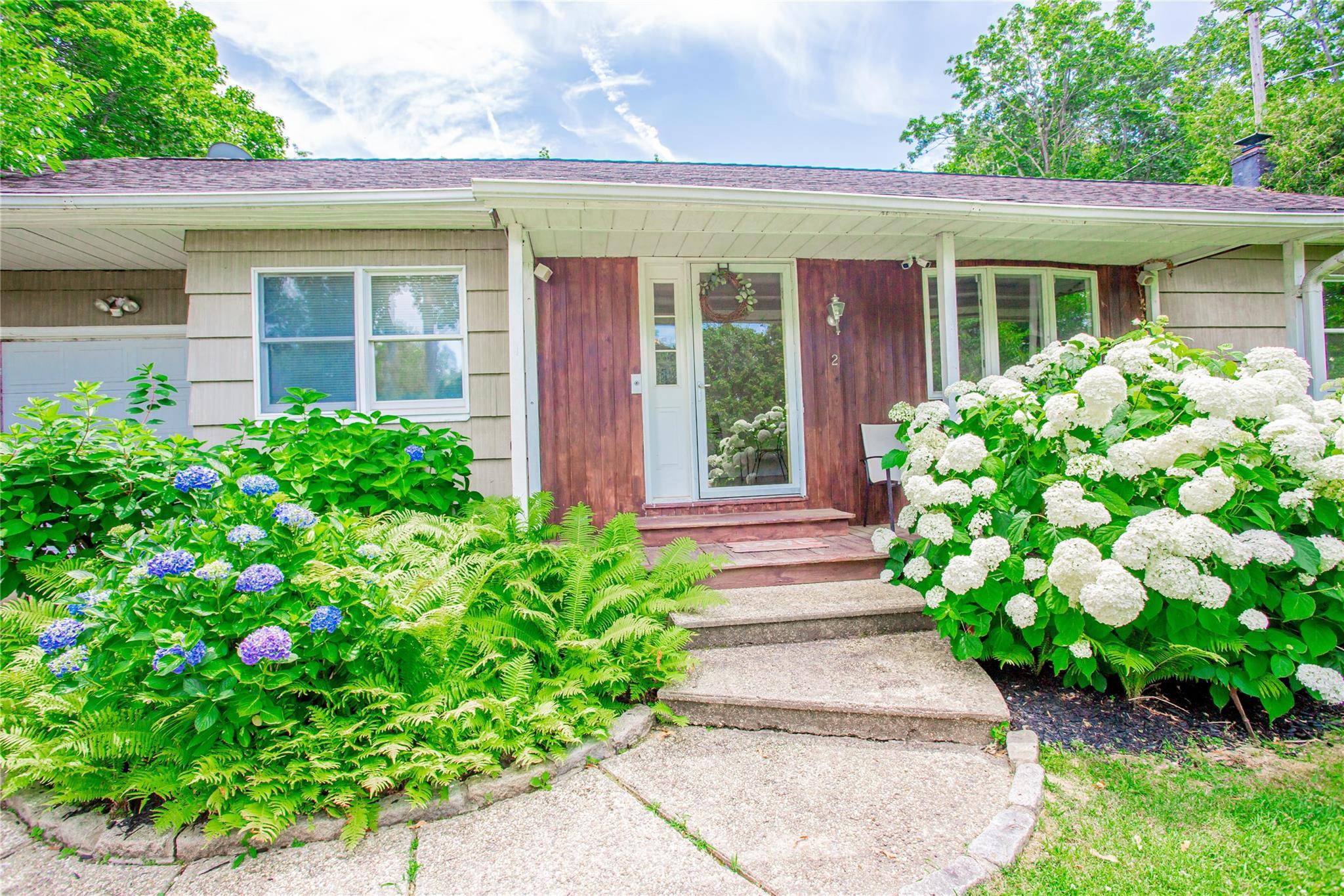 Welcome to this beautifully updated home in the desirable Ridgefield Highlands Association, offering private beach access and set on a generous 1 3 of an acre lot.