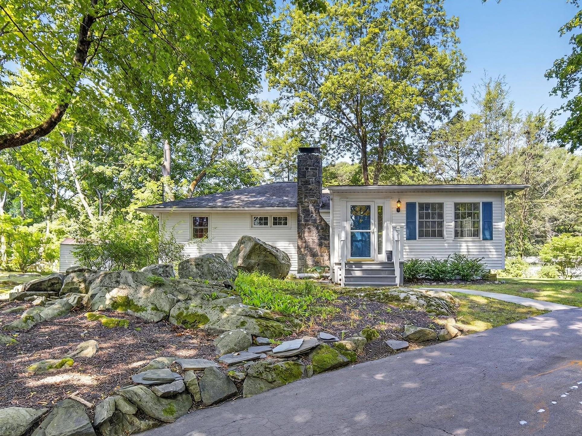 This charming ranch home, tucked away on a private setting, is located in the desirable Mahopac Hills Association w lake rights.