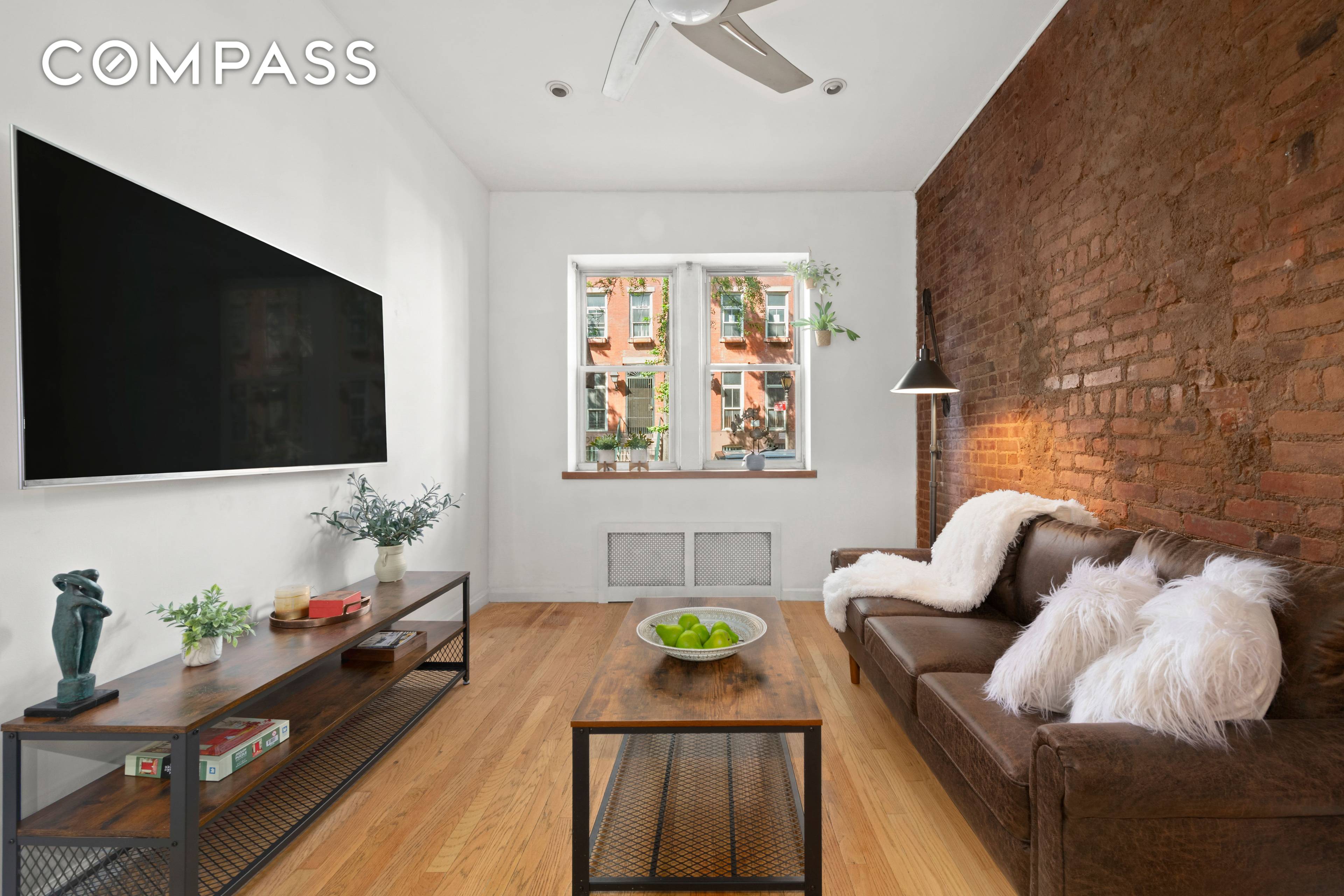 Welcome to Apartment 1B a raised ground floor, renovated one bedroom that artfully blends prewar character with sleek, modern touches.