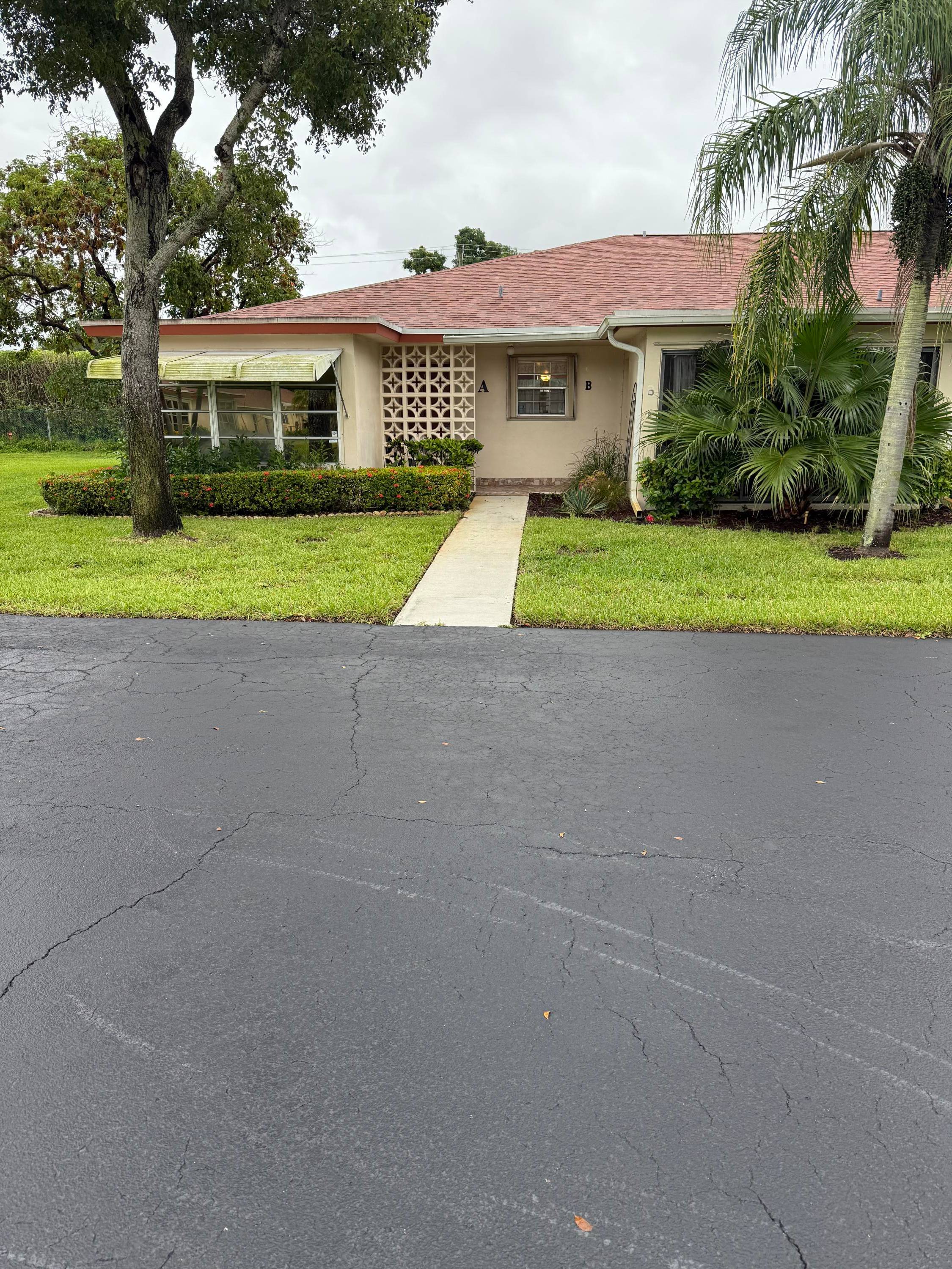 BEAUTIFUL, BRIGHT AND SPACIOUS END UNIT IN HIGHLY DESIRABLE SECTION 7 VERY WELL MAINTAINED, ENCLOSED FLORIDA ROOM WITH RAISED WOOD FLOOR.