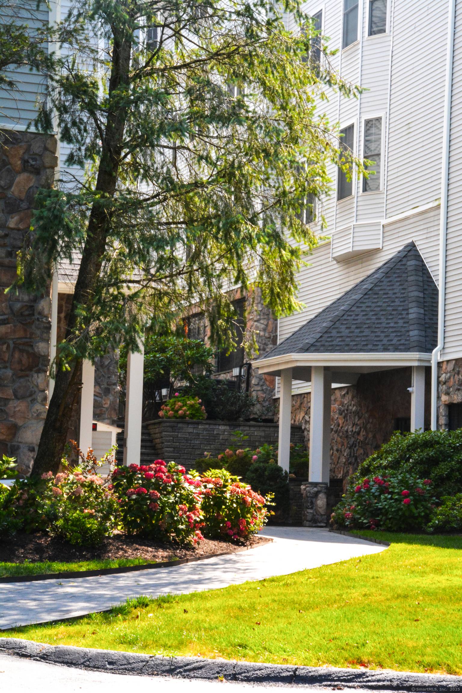 Discover modern living in this 2 bedroom, 2 bathroom 'Carriage House' condo, perfectly positioned on the 4th floor as a rear corner unit with no overhead neighbors, ensuring exceptional privacy.