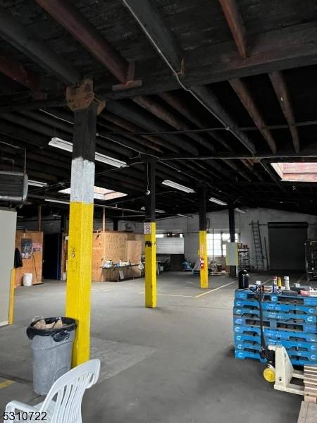 Huge warehouse space approx 7000 sq ft nestled right off Elizabeth Ave, separate garage doors, loading dock, Heavy duty electric, was formerly a water bottling company.