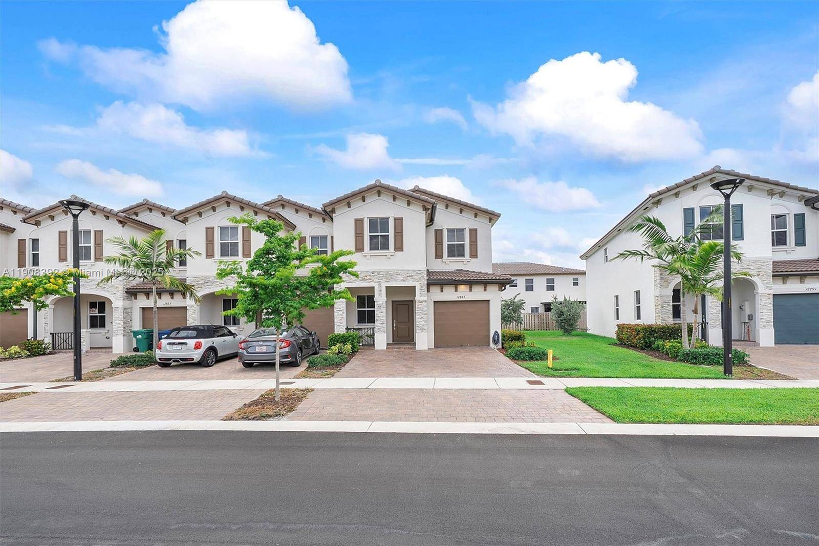 CORNER TOWNHOUSE WITH CAR GARAGE AND PRIVATE DRIVEWAY.