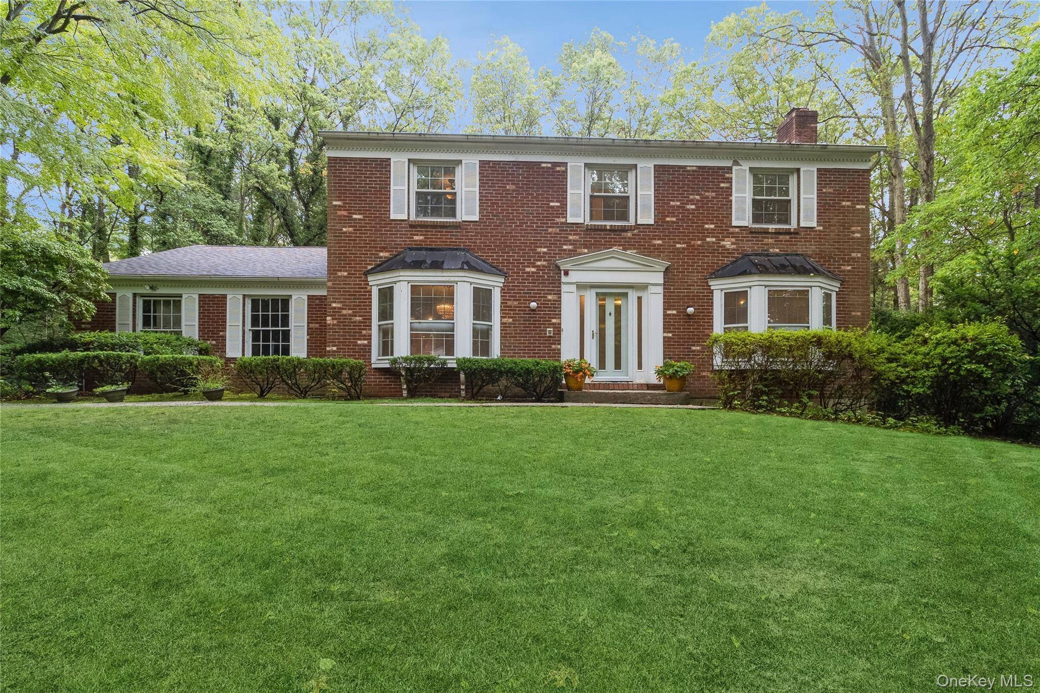 Expanded Exeter Brick Front Stately Center Hall Colonial in Prime Cul de Sac in the Strathmore Section off Wilmington Drive.