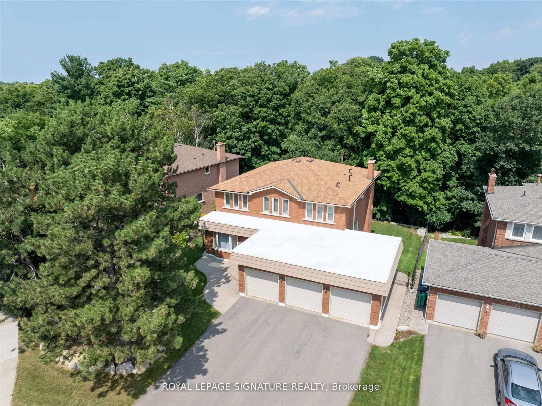 Backing on a meadering creek, soaring magestic trees and nature trails that seamlessly blend nature and urban living, there is something special about this home.
