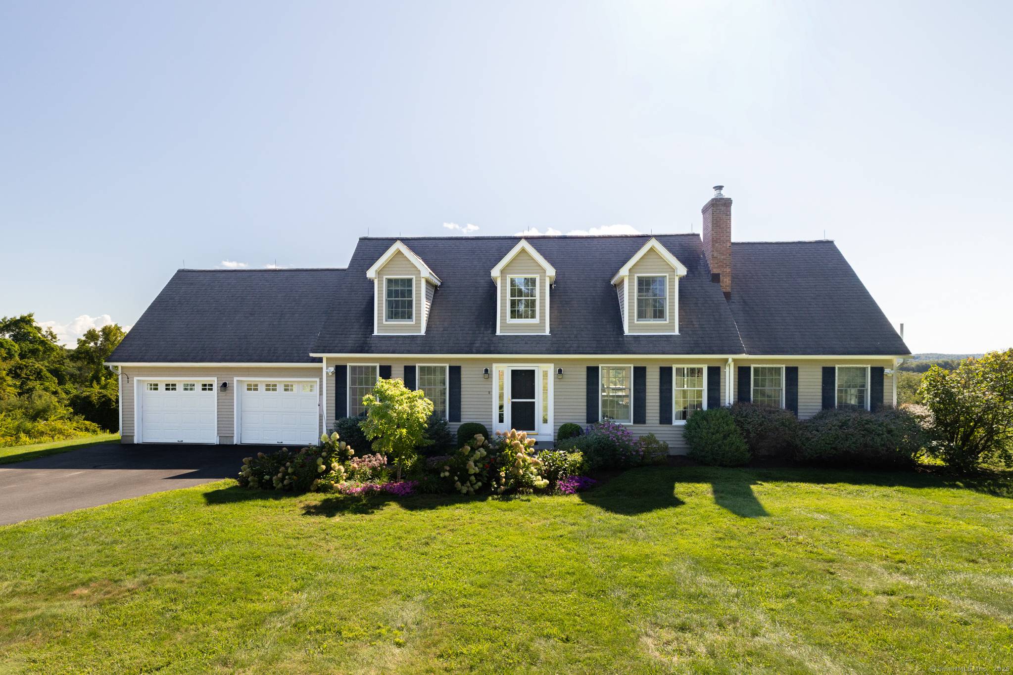 Tucked away on 8 private acres at the end of a cul de sac, this Bantam Cape Cod offers some of the best views in Litchfield County !