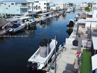 Step into your slice of paradise with this fully remodeled Key Largo home, featuring elegant all tile floors and two separate living areas perfect for hosting guests or creating your ...