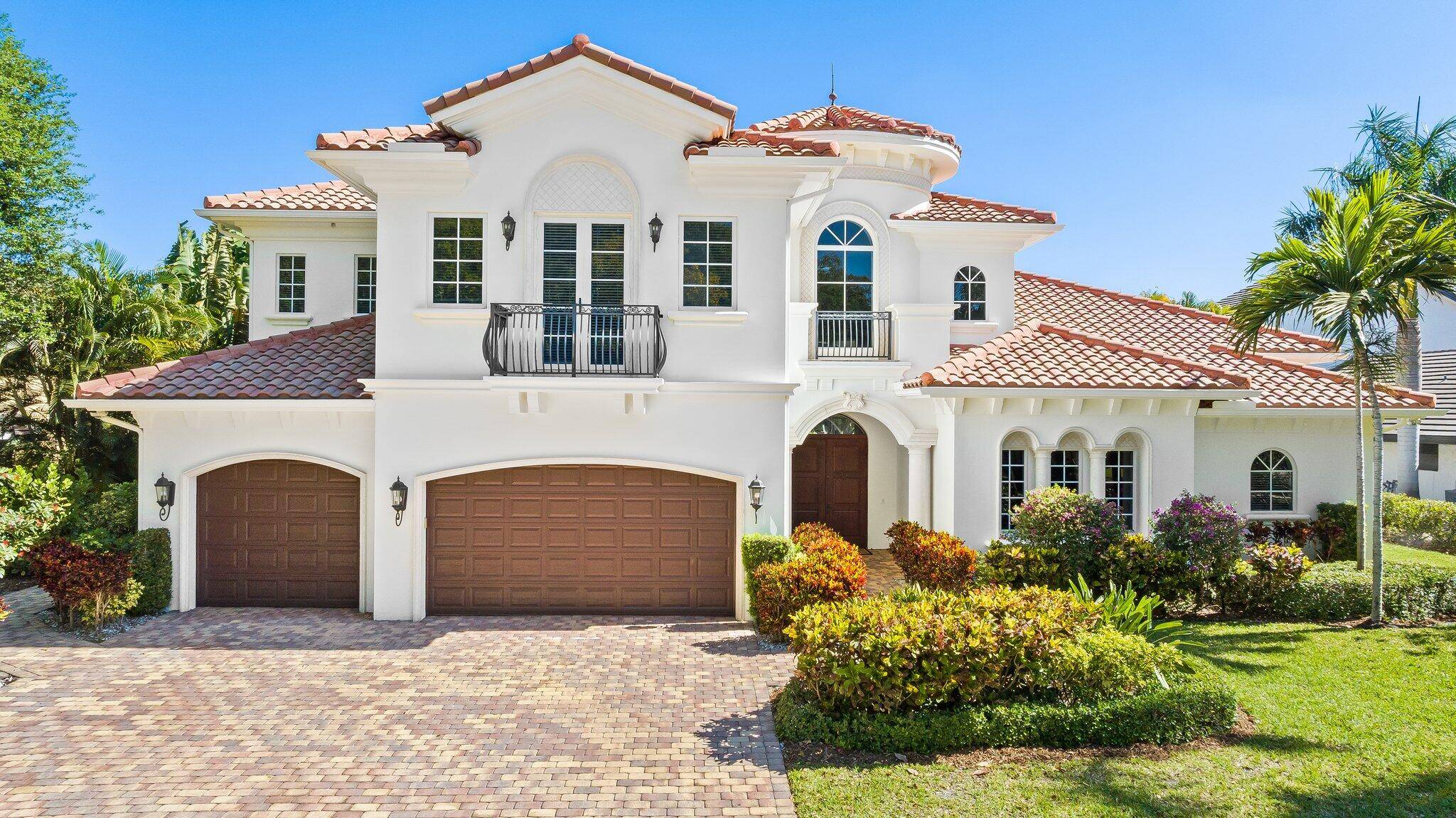 Magnificent custom built home on one of the best park and lake lots in the very desirable Boca Bath and Tennis Club.