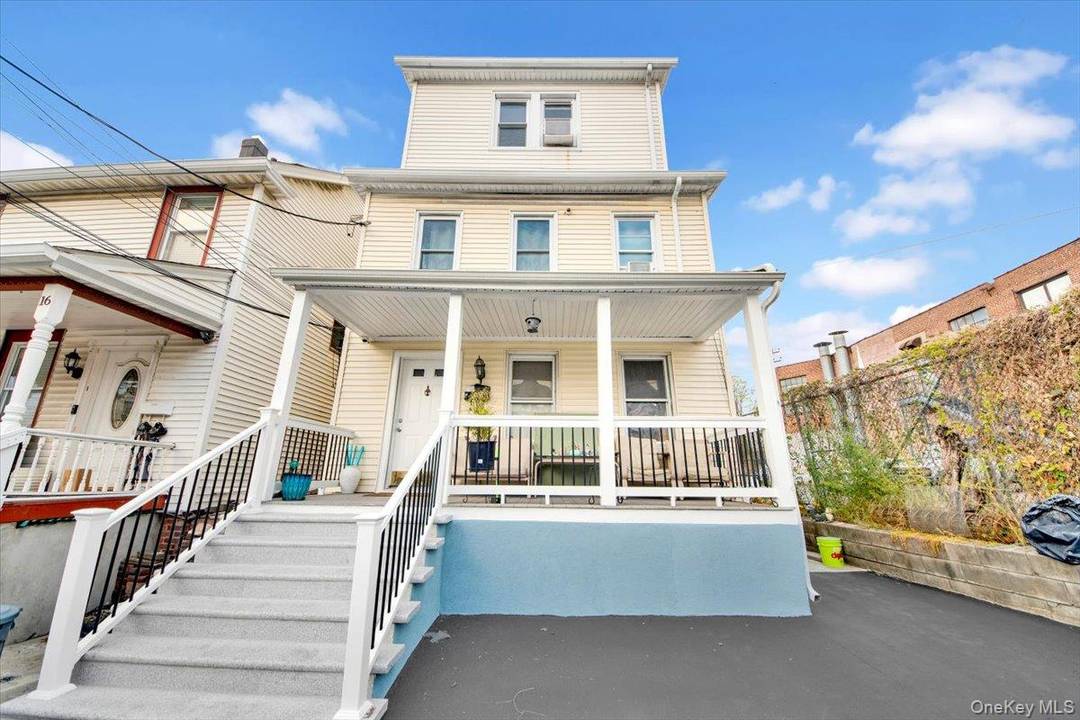 Discover this versatile and inviting two family residence situated just minutes from the vibrant New Roc City Center.