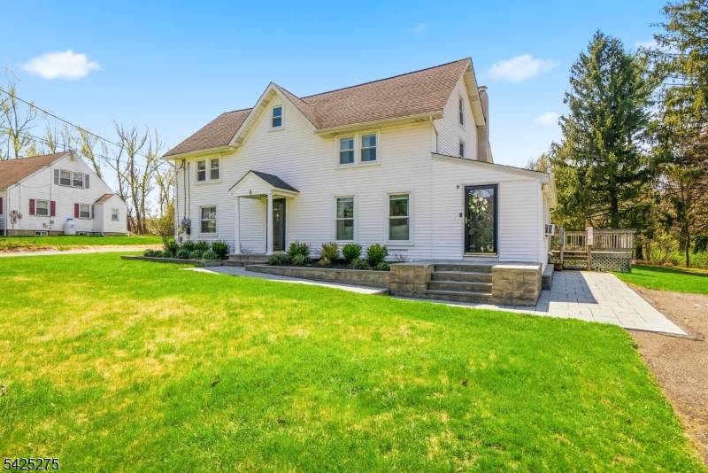 A rare and versatile opportunity in highly sought after Randolph, this side by side, two family home offers flexibility, privacy, and long term value on an expansive 1.