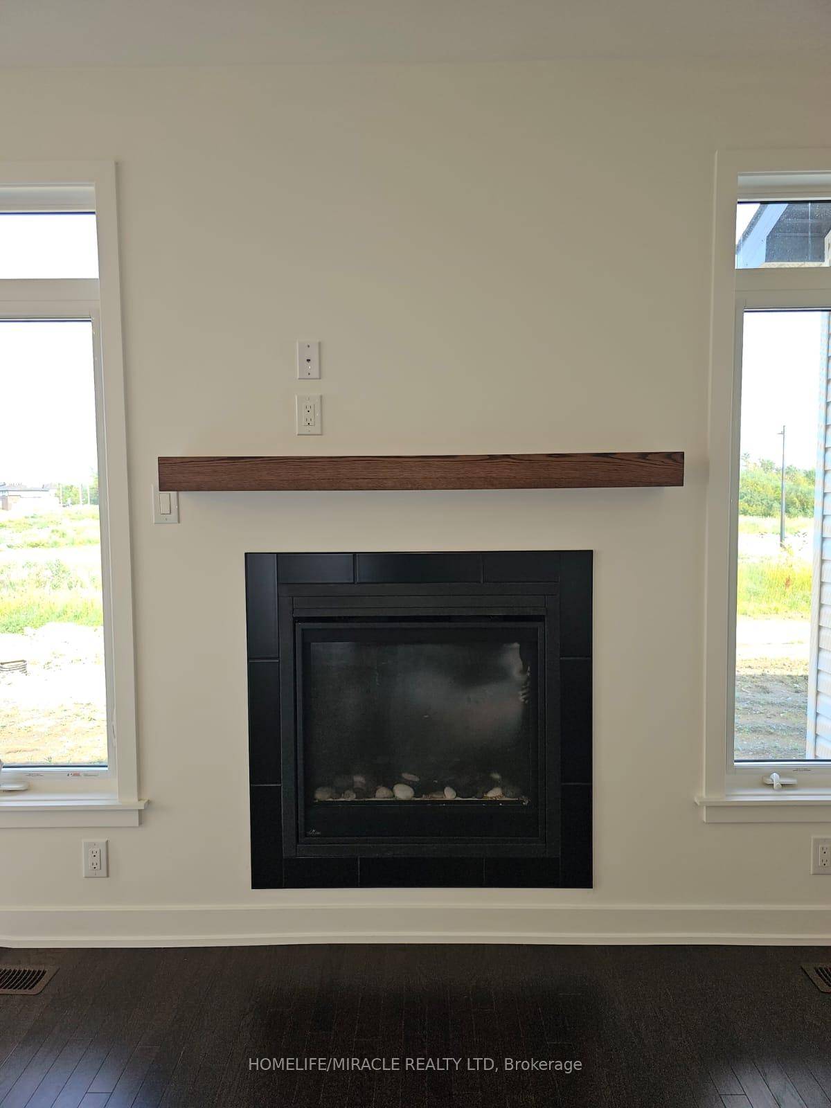 This beautiful end unit townhouse is available for lease, offering a modern kitchen with an extended island, stylish backsplash, chimney hood, quartz countertops, and an undermount sink.
