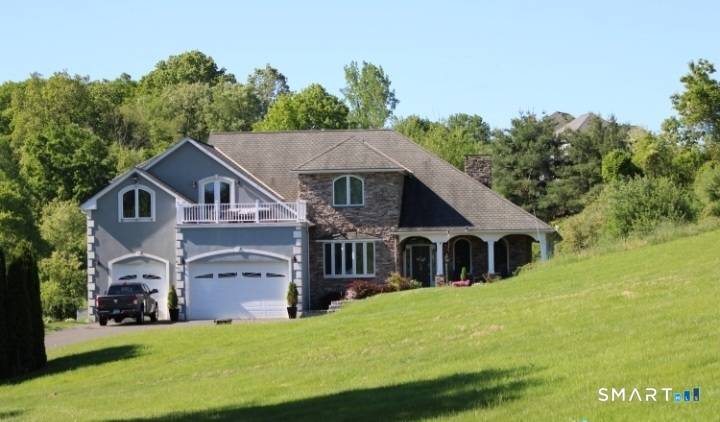 Customed Colonial home presents itself with cherry wood flooring throughout the main floor of the home.