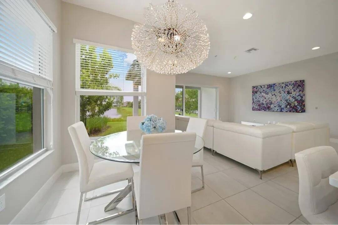 Welcome to this beautiful single story lakefront home at 15371 Green River Court in Delray Beach.
