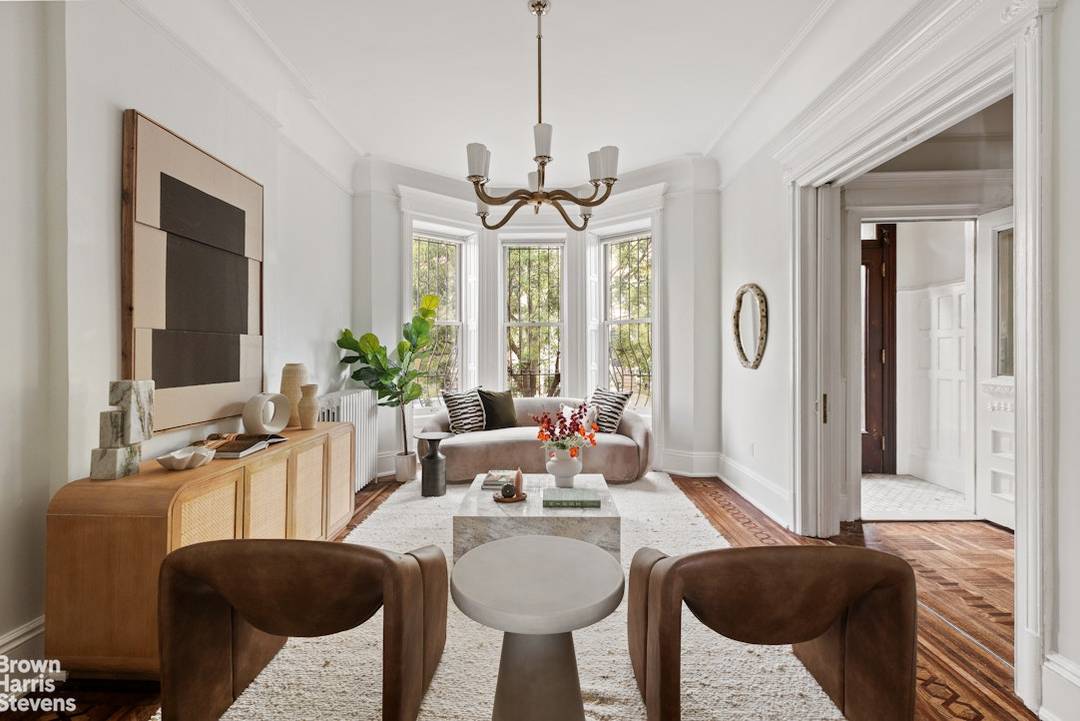 With a two car garage and long driveway with space for four additional parking spots, an expansive backyard patio, and a full lounge level with a wet bar, 36 Rutland ...