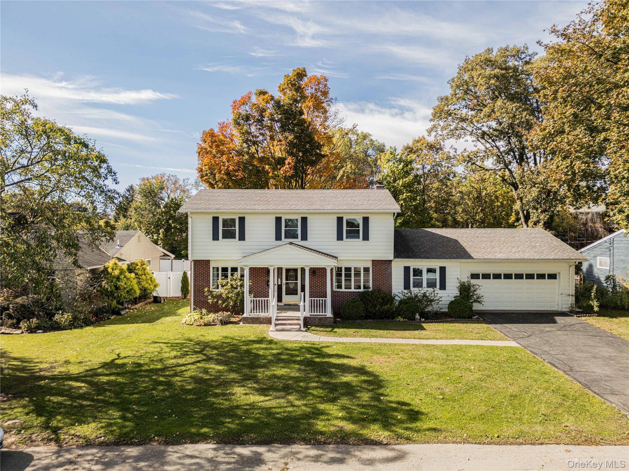 Welcome to Sycamore House, a classic 1964 mid century home tucked on a quiet dead end street just minutes from downtown Hudson.