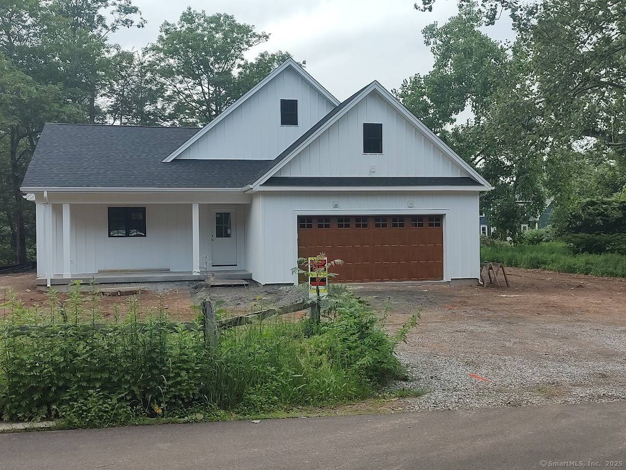 A custom built 2 Bed plus Primary Suite ranch with a 1.