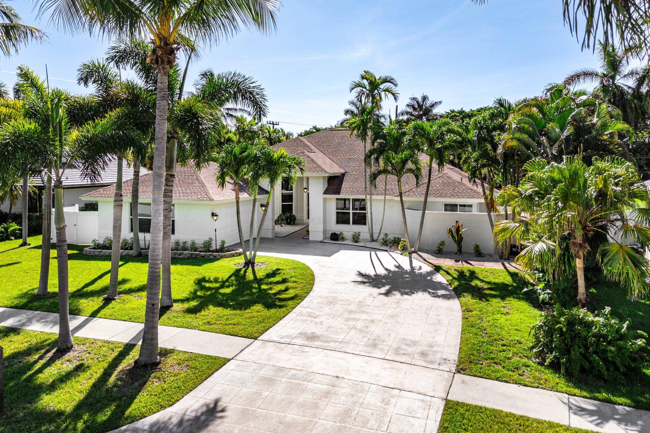 Nestled in the heart of Boca Raton's prestigious Hidden Valley community, 7700 Fairway Trail presents a striking single family home poised to capture attention immediately.