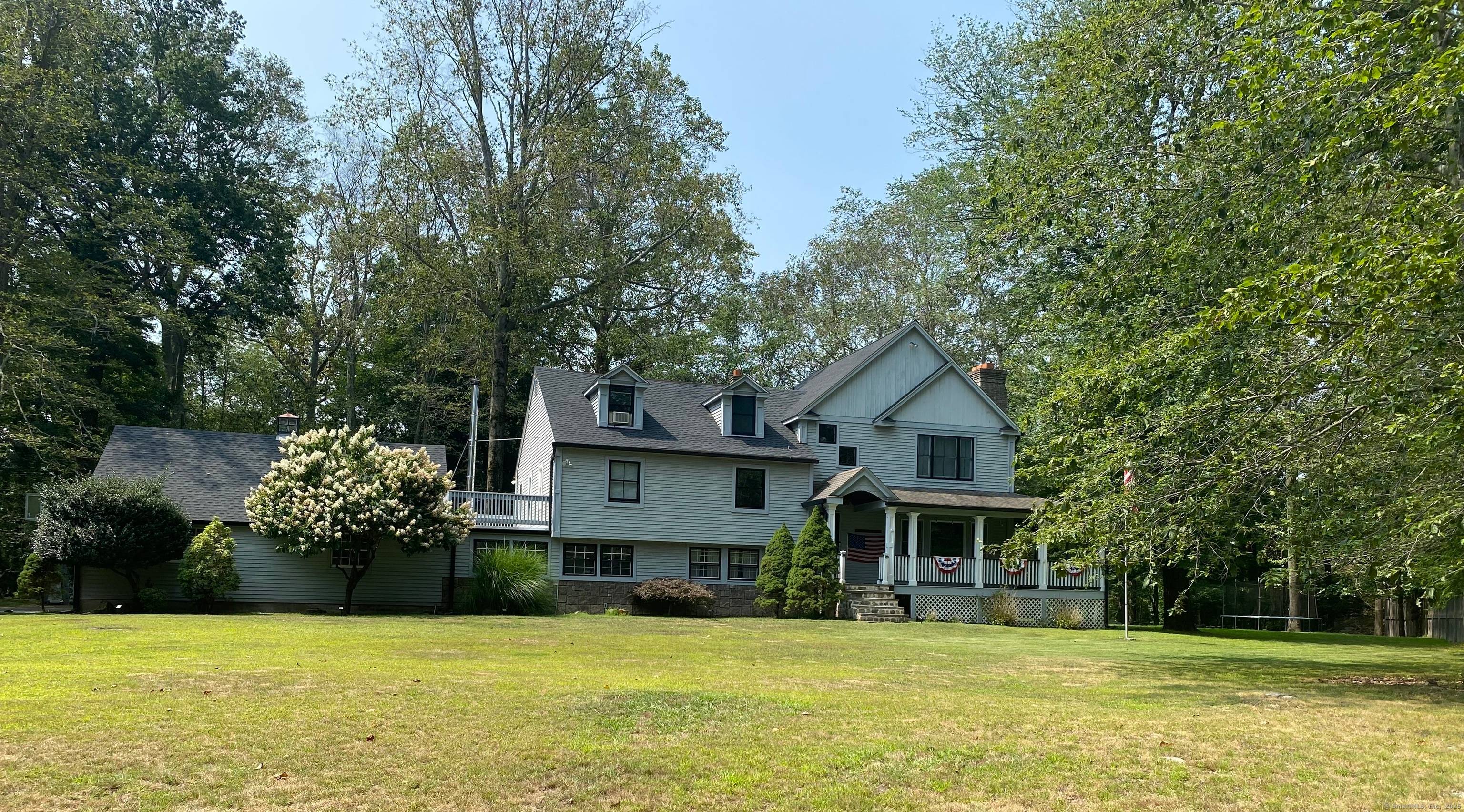 Nestled on a level one acre lot within a coveted cul de sac and surrounded by higher end homes, this beautifully updated residence offers five spacious bedrooms and four well ...