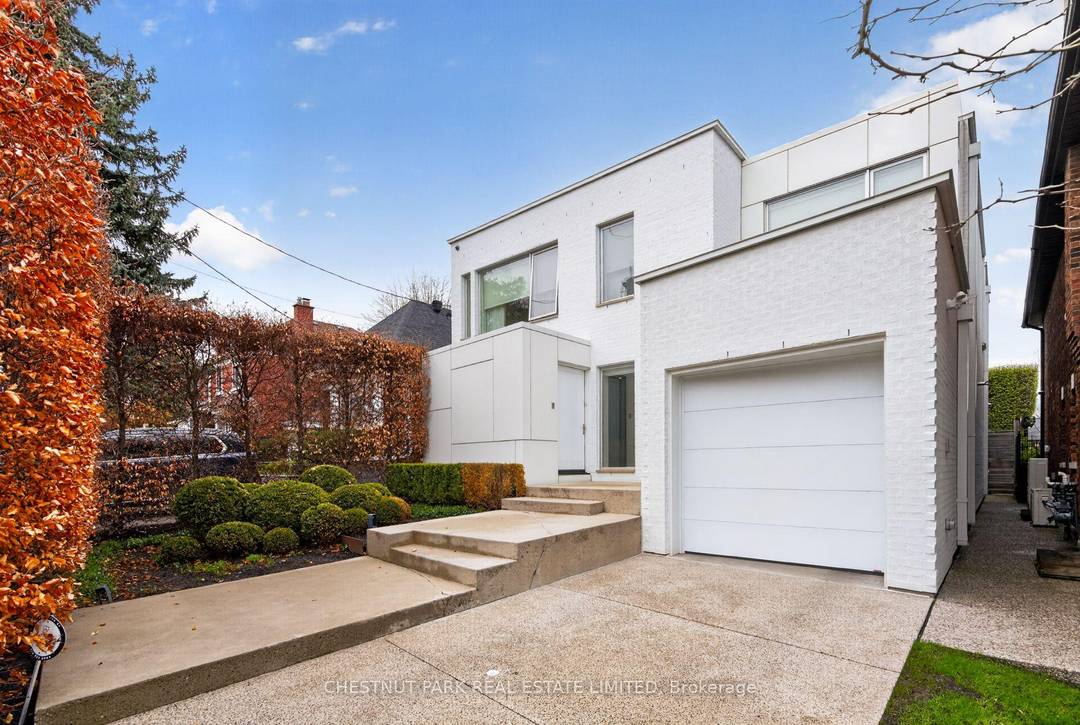 Tucked within the tree lined streets of Caribou Park, this remarkable custom residence blends understated luxury, thoughtful design, and exceptional privacy.