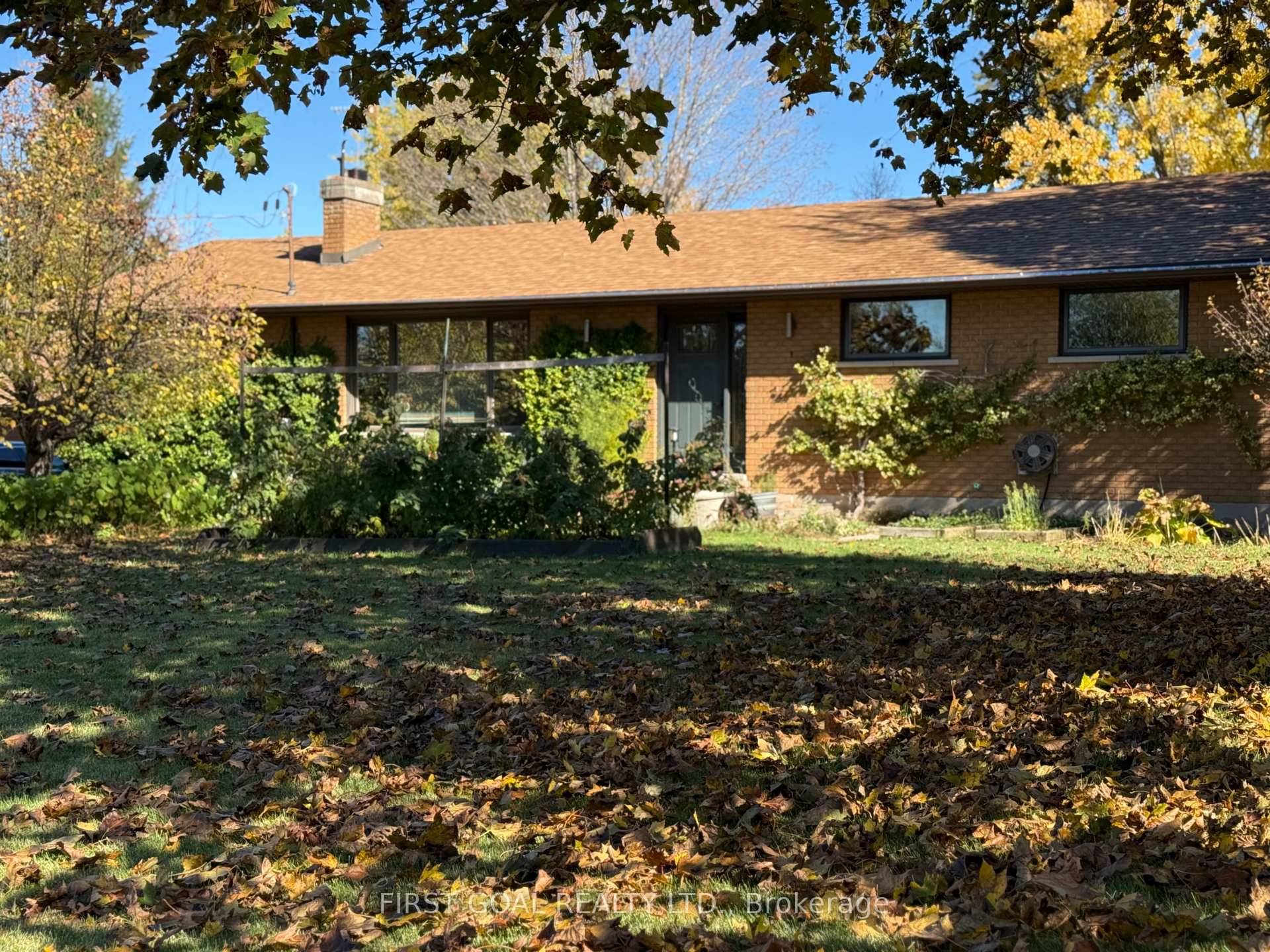 STAY CONNECTED WITH HIGH SPEED FIBER OPTIC INTERNET in this charming brick bungalow, nestled in a beautiful country setting, surrounded by lush gardens and serene pond.