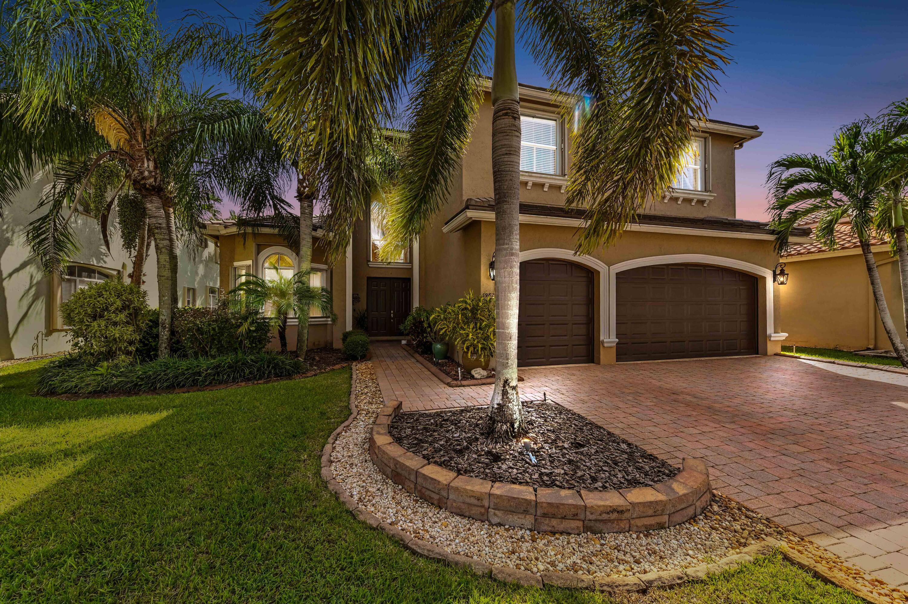Welcome to this stunning, executive pool waterfront home, perfectly situated in the highly sought after, Journey's End community in Lake Worth.