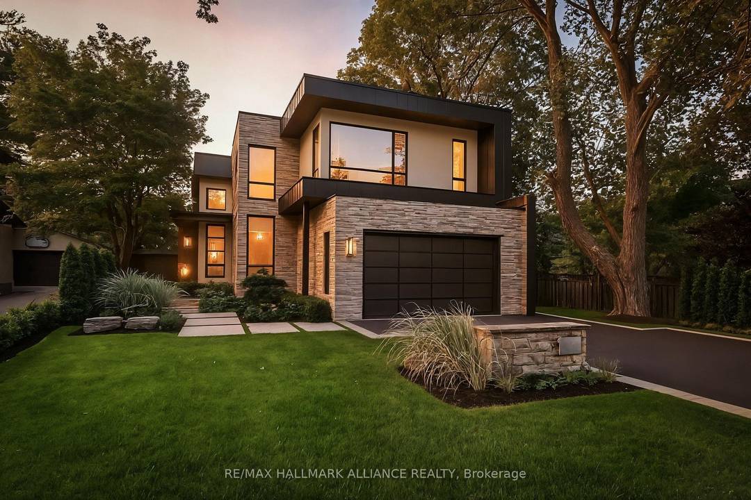 Welcome to this architecturally striking modern custom home, artfully crafted on a premium 0.