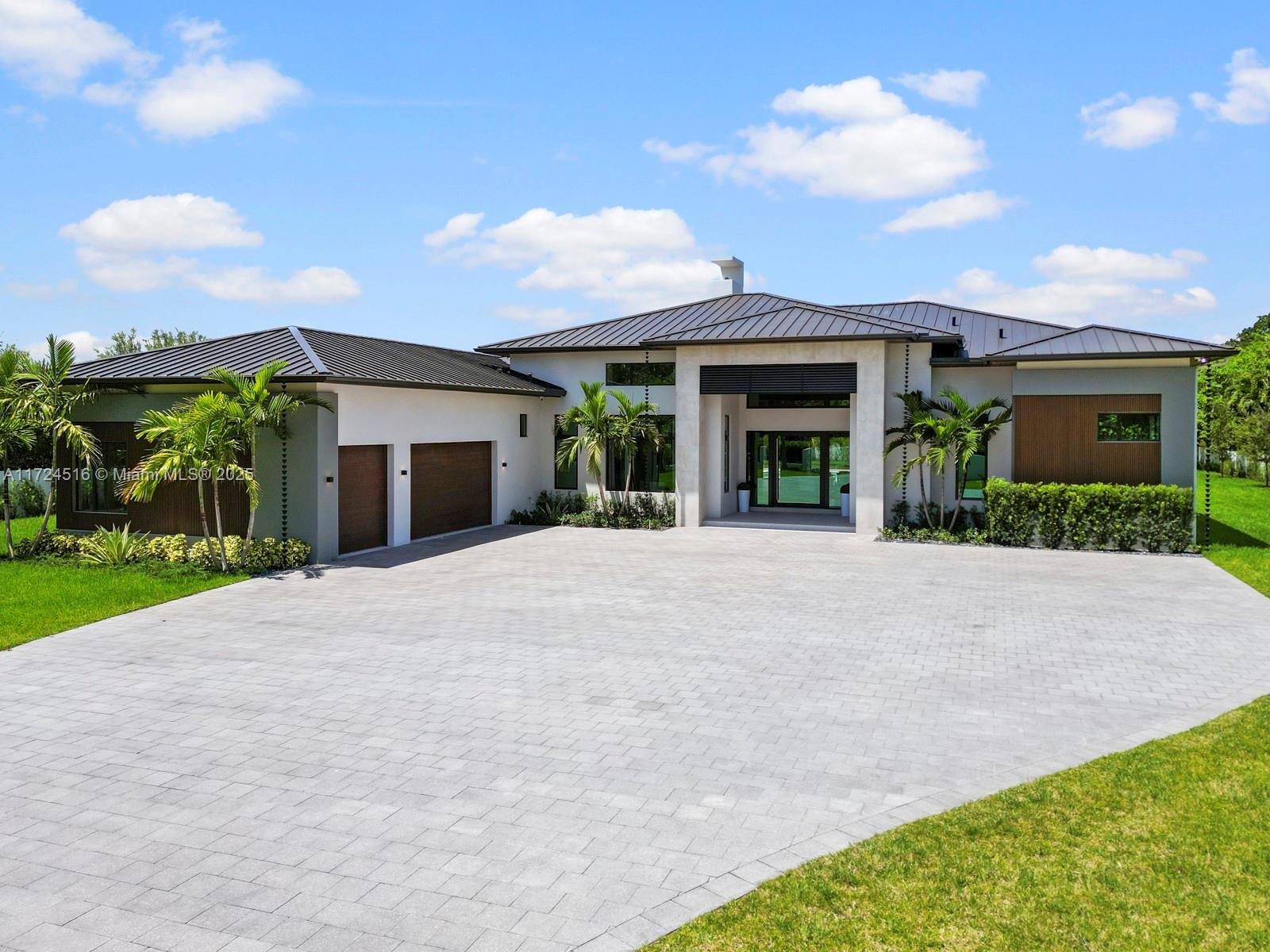 Completed in 2025, this newly built custom estate sits on over an acre, offering 7, 471 sqft of refined modern living.