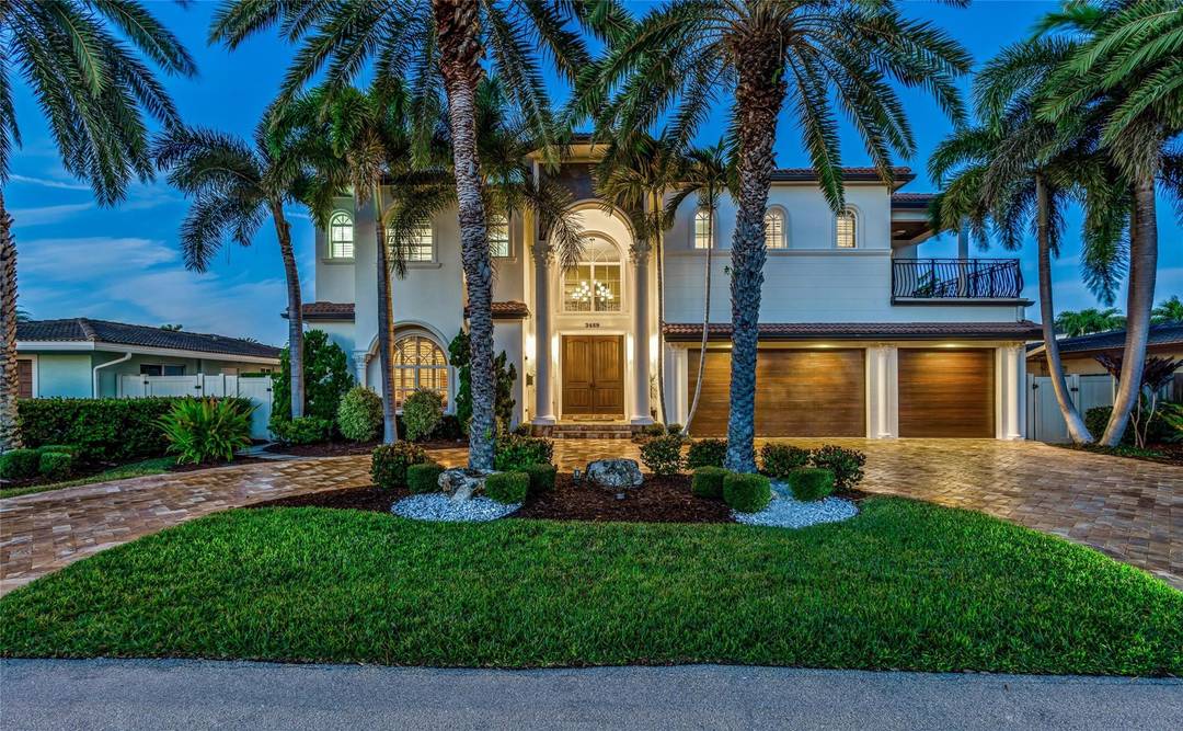 Exceptional Mediterranean deepwater estate sited on 80 of waterfrontage, offering 6 bedrooms, 6.