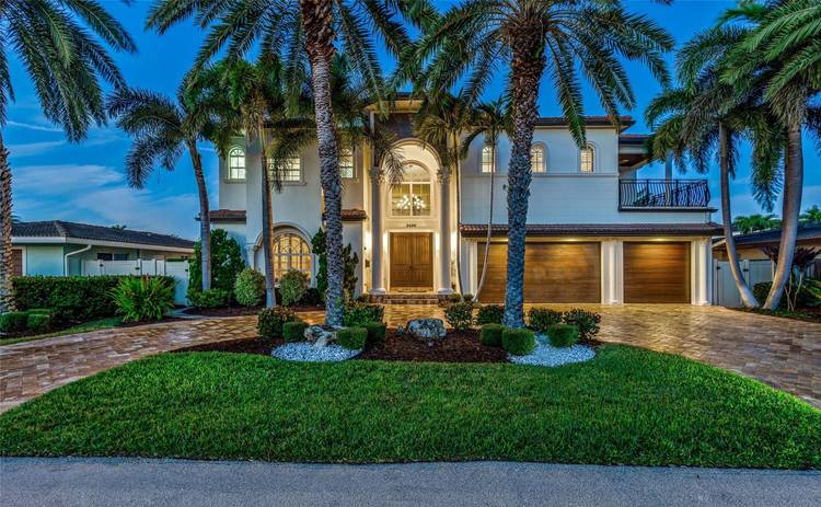 Exceptional Mediterranean deepwater estate sited on 80 of waterfrontage, offering 6 bedrooms, 6.