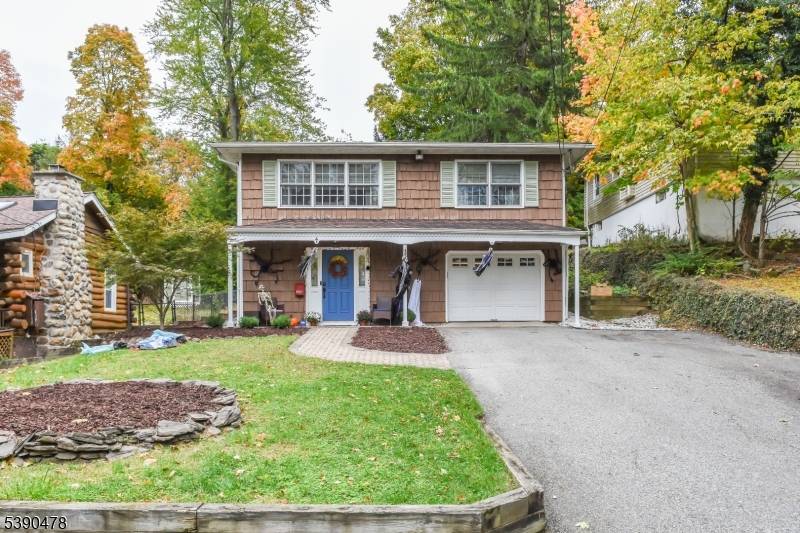 Welcome to your new sanctuary in the heart of one of Wayne's most sought after neighborhoods, Packanack Lake !
