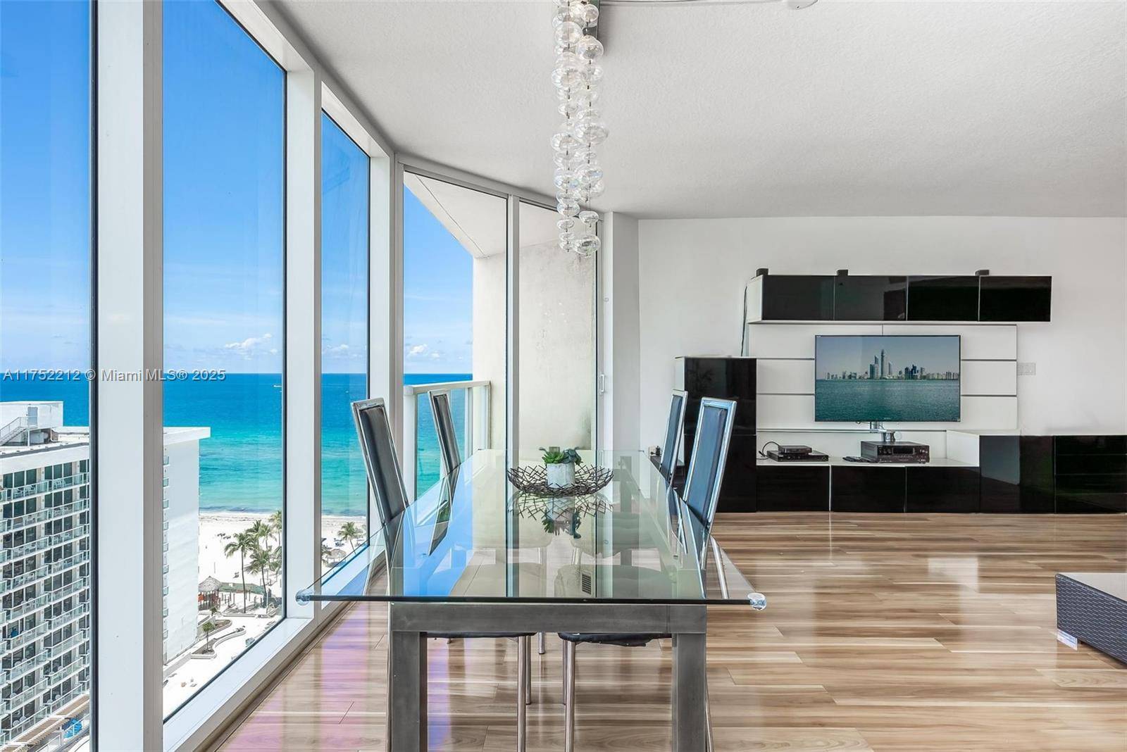 Rare corner unit in La Perla Condominium with a wraparound balcony offering East, North, and West views enjoy ocean sunrises, cityscapes, and sunsets with natural light all day.