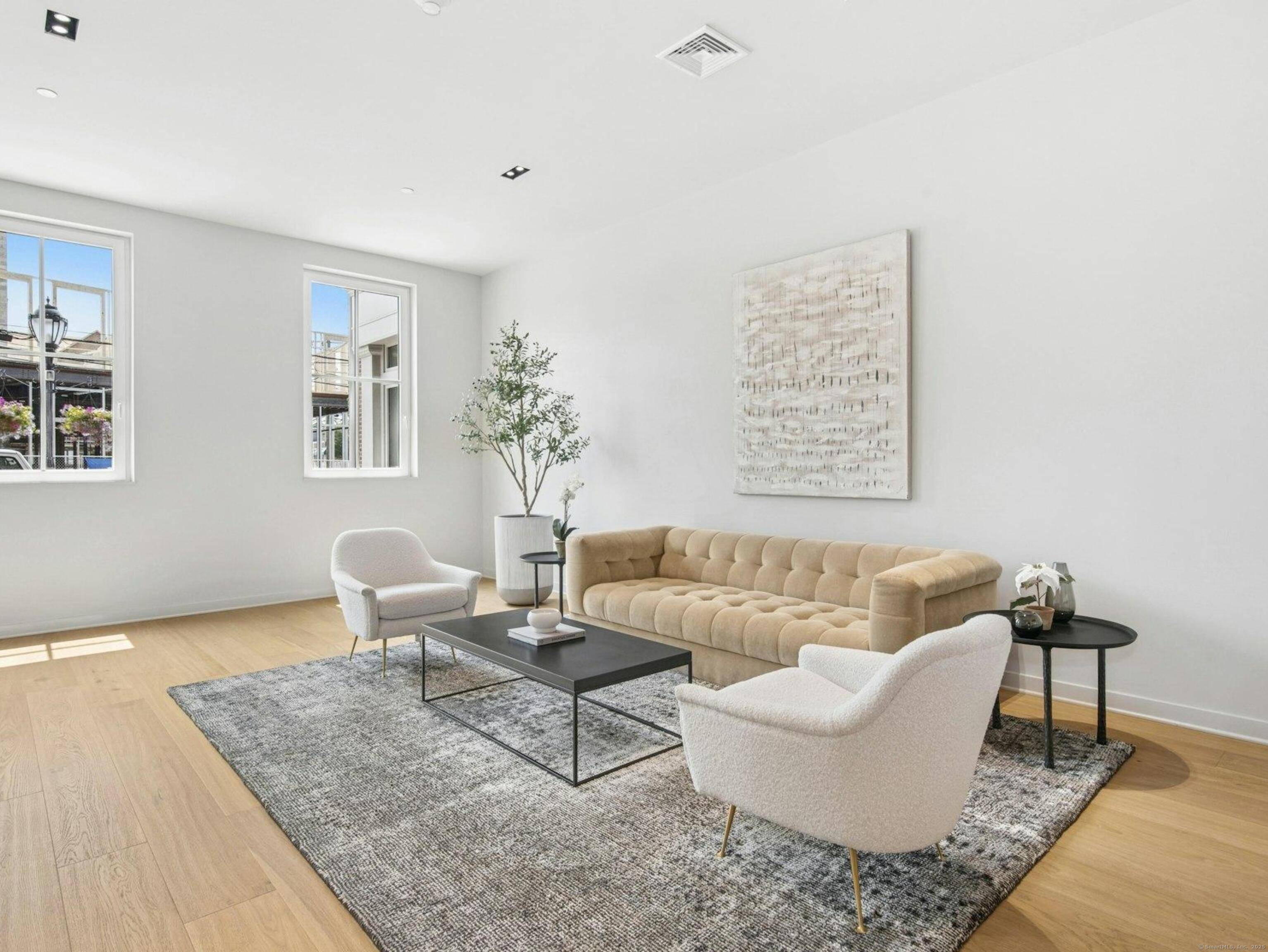 Step into this luxury corner unit that offers refined elegance, modern design, and privacy all in the heart of downtown Darien's premier neighborhood, The Corbin District.